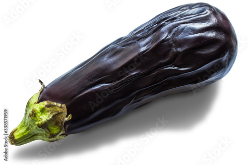 Old limp vegetable eggplant close up isolated on a white background