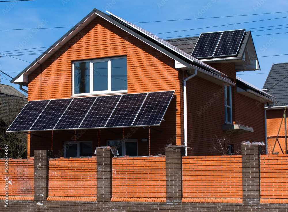 Fototapeta premium building a house with solar panels on the roof