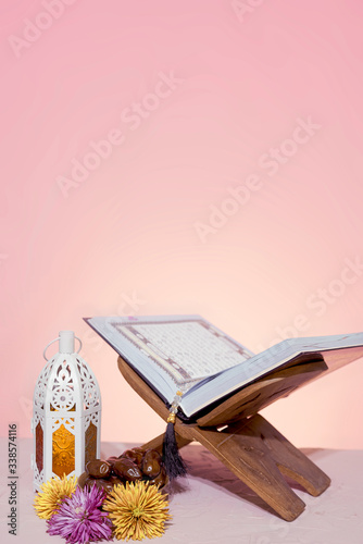 Ramadan background. Rehal with open Quran. Quran open in wooden placemat photo