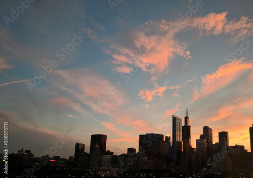 Dramatic Sunset and Clouds Over the City © Caleb