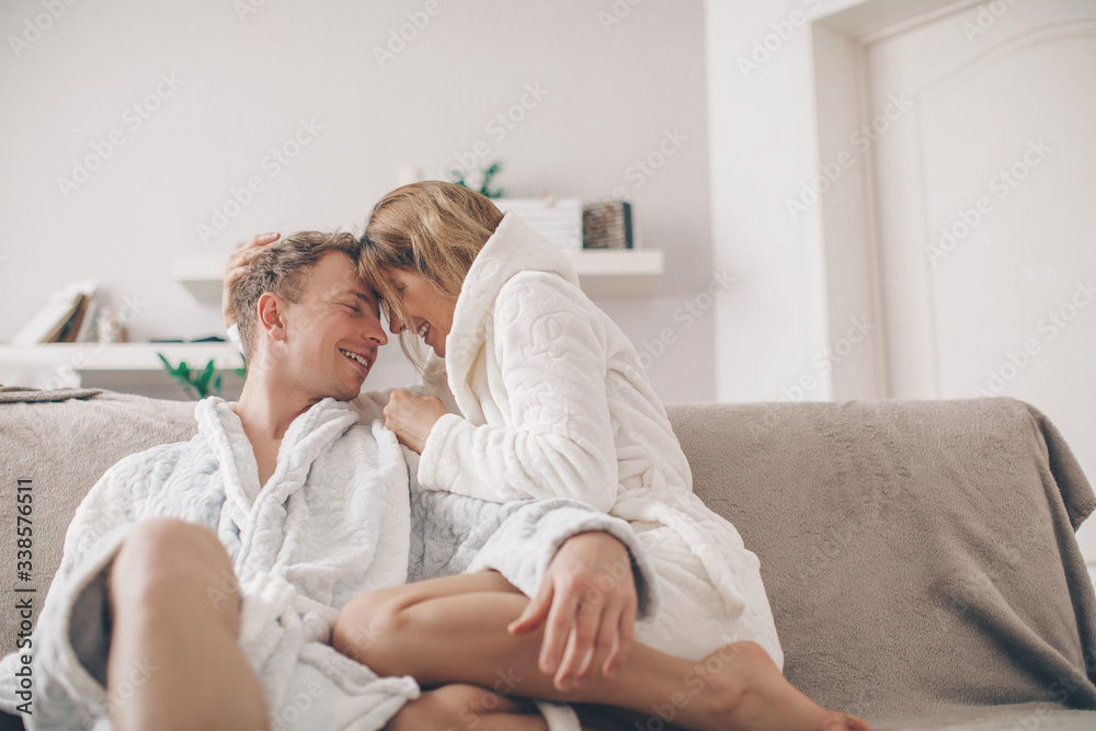 senior woman with her sick daughter. Couple in love. Man and woman home. Sofa. senior woman with her sick daughter. Couple in love. Man and woman home. Sofa.