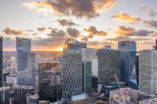 Aerial drone shot of La Defense CBD Skyscraper complex business district skyscrapers during sunset photo