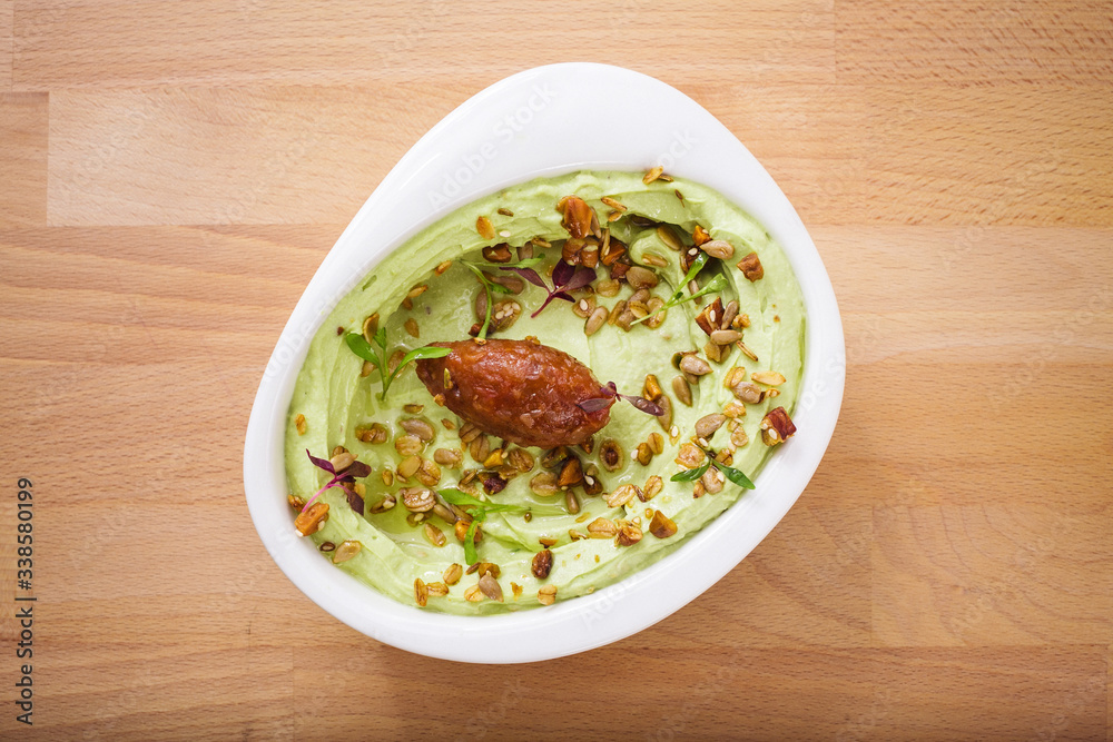 Organic plant based hummus with granola and dates. Perfect for vegan gluten free. Freshly homemade for takeaway and delivery. Arabic food photography. Organic plant based hummus with granola and dates. Perfect for vegan gluten free. Freshly homemade for takeaway and delivery. Arabic food photography.