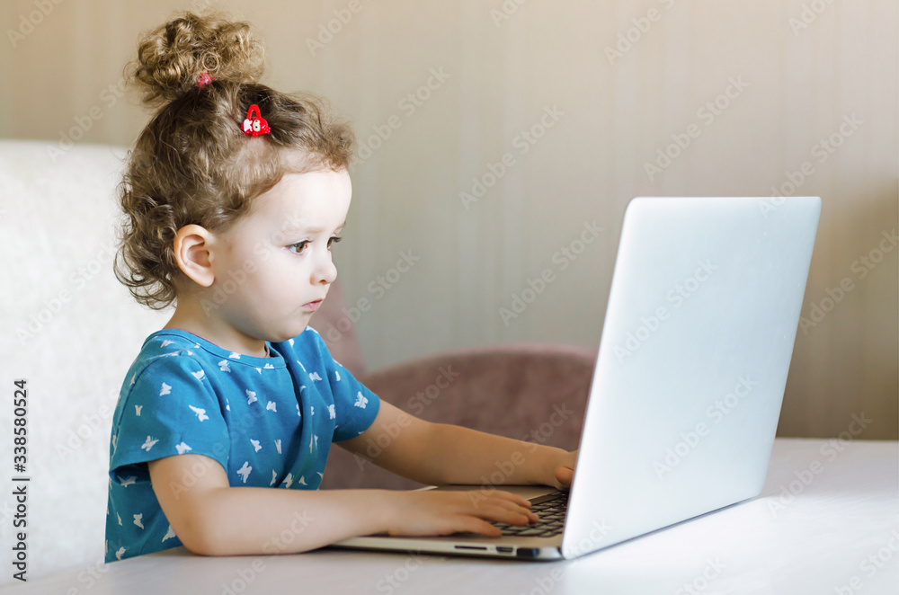 Distance learning online education. girl studying at home with laptop notebook  computer and doing school homework.