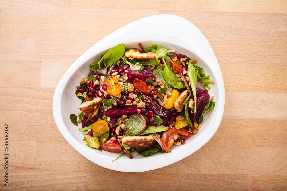 Tasty homemade vegan salad with granola grilled cheese and beet root. Organic food photography. For healthy living lifestyle. Food photography. Tasty homemade vegan salad with granola grilled cheese and beet root. Organic food photography. For healthy living lifestyle. Food photography.