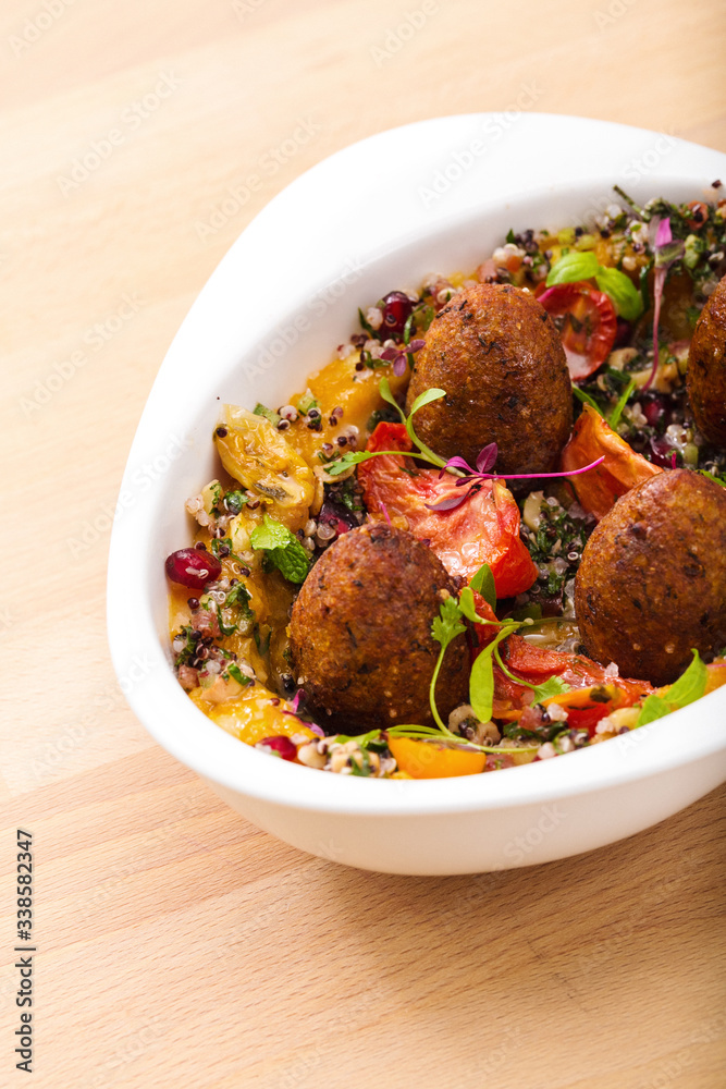 Delicious healthy salad with falafel and dried tomatoes. For healthy living. Perfect for takeaway and delivery. Vegan food photography. Delicious healthy salad with falafel and dried tomatoes. For healthy living. Perfect for takeaway and delivery. Vegan food photography.