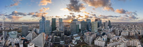 Aerial panoramic drone shot of La Defense skycraper in Paris CBD skyscraper complex business district with clouds during sunset