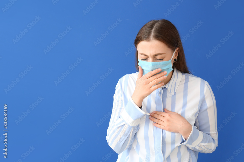 Sick woman in protective mask on color background. Concept of epidemic Sick woman in protective mask on color background. Concept of epidemic