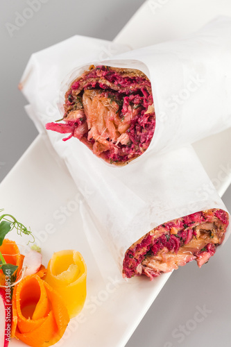 Delicious salmon and beetroot shawarma for healthy living. Food photography perfect for delivery and takeaway concept focus view.