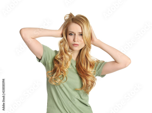 Portrait of beautiful young woman with dyed long hair on white background