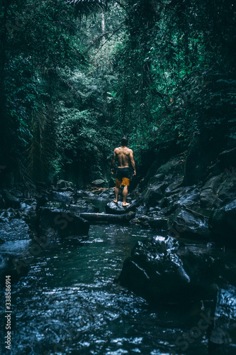 Fototapeta Naklejka Na Ścianę i Meble -  man on jungle river