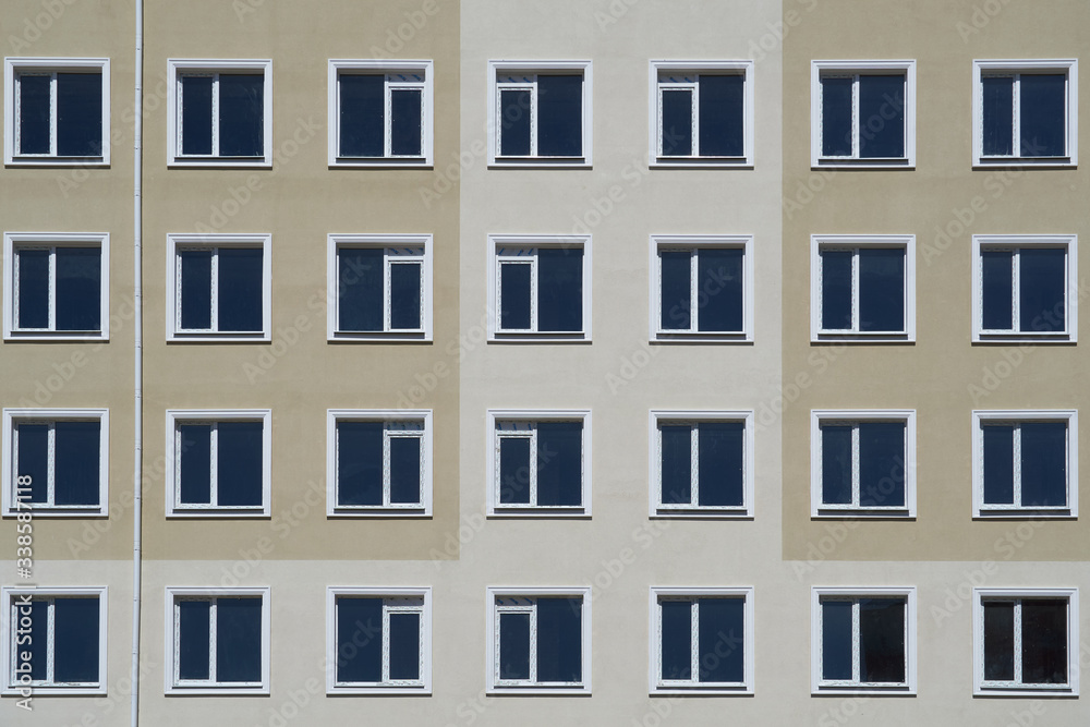 facade of a new multi-storey building with many windows facade of a new multi-storey building with many windows