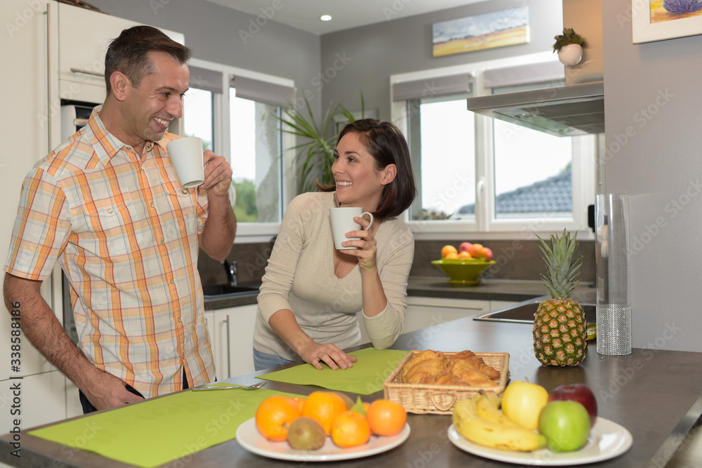 Happy couple having a wonderful breakfast time at home Happy couple having a wonderful breakfast time at home