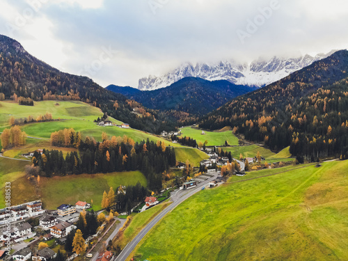 Sunset over the peaks of Puez Odle Nature Park in South Tyrol, Italy. the village of San Pietro. photo