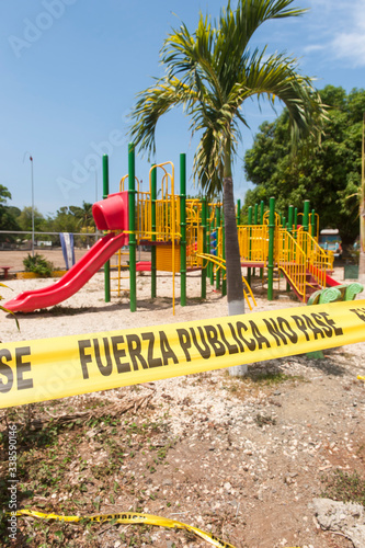 Childrens play area closed with police tape in Guanacaste, Costa Rica during Covid-19 © mylitleye