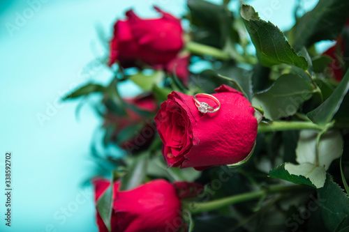 Diamond Ring On Red Rose, eart shaped box with red roses. photo