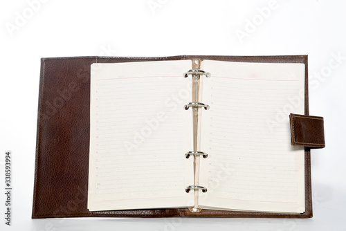 Wallpaper Mural Notebookwith leather cover, notepad on white background with space for text Torontodigital.ca