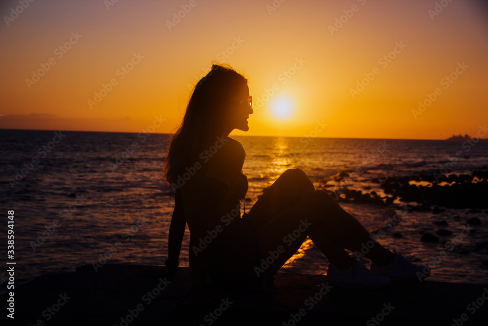 woman backlight sunset beach.