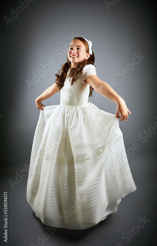 Gorgeous young girl dressed in white