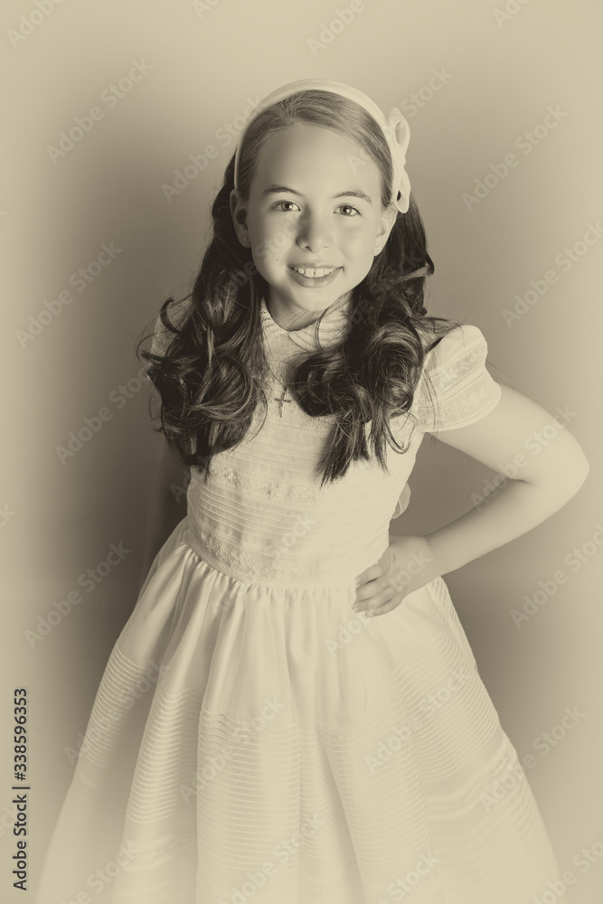 Fototapeta premium Gorgeous young girl dressed in white