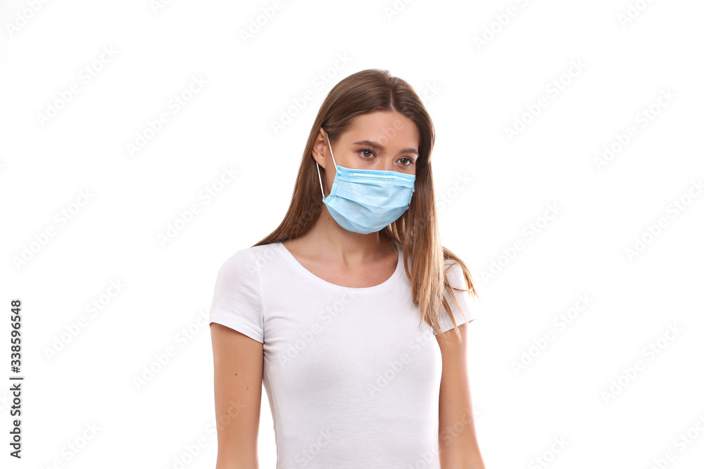 European girl in medical mask. Conceptual photo on the theme of the covid-2019 pandemic. European girl in medical mask. Conceptual photo on the theme of the covid-2019 pandemic.