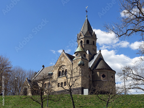 Löwenzahnwiese vor der neoromanischen Erlöserkirche Mirbach photo