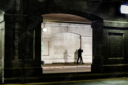 man on street with shadow
