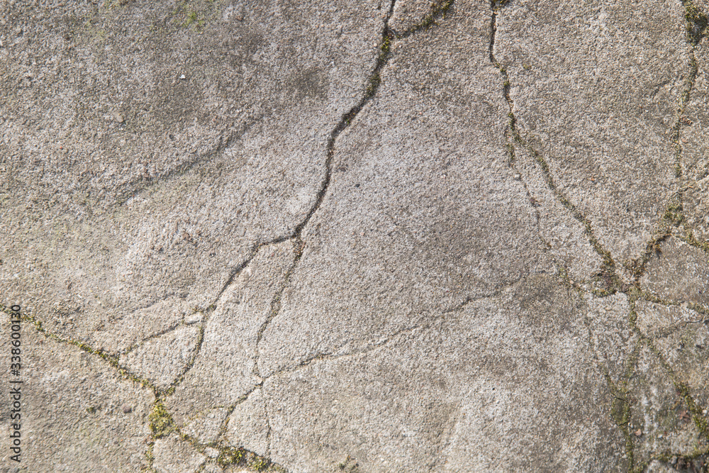 Obraz premium Cracks in a concrete footpath