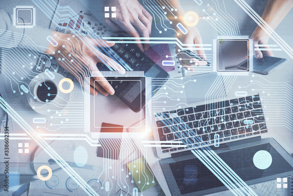 © peshkova - Double exposure of man and woman working together and data theme hologram drawing. Computer background. Top View.