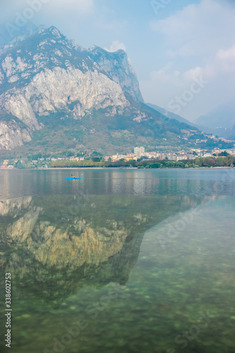 San Martino mountain and Bergamo Alps reflect in the water of Lake Como near the village of Lecco, Lombardy, Northern Italy © Anastassiya