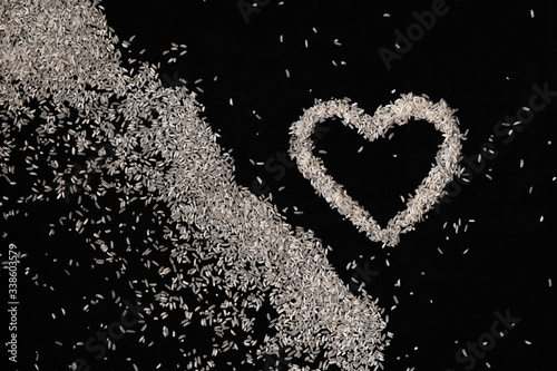 heart made of rice on dark backgrounds