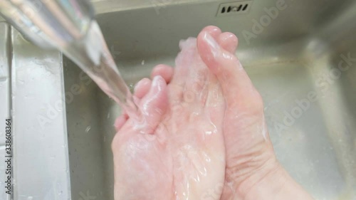 Personal perspective of a man washing his hands
