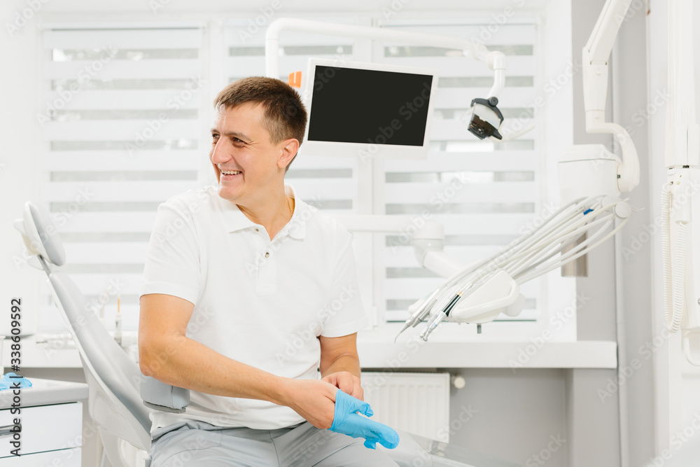 Man dentist at his working place