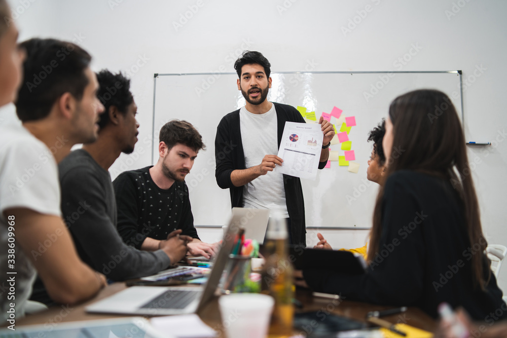 Manager leading a brainstorming meeting. Manager leading a brainstorming meeting.