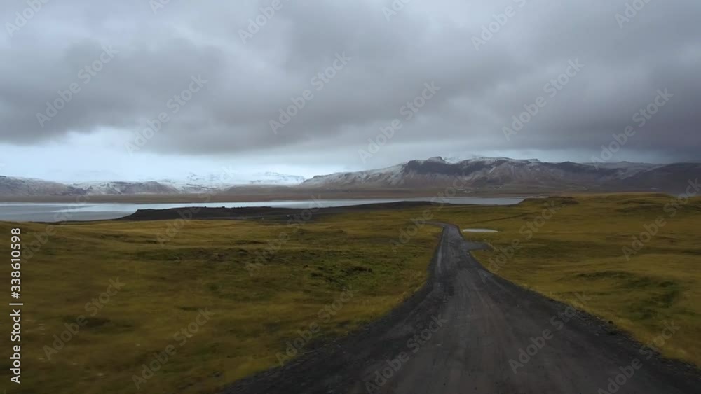Tracking shot camera moves fast in a beautiful landscape with meadow and mountain in background Tracking shot camera moves fast in a beautiful landscape with meadow and mountain in background