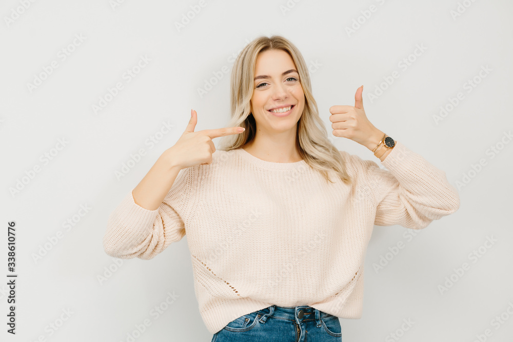 Blonde girl giving thumbs up at dentist office Blonde girl giving thumbs up at dentist office