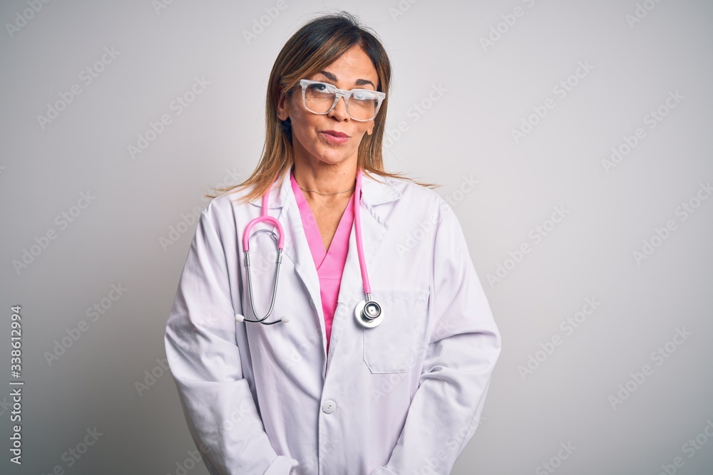 Middle age beautiful doctor woman wearing pink stethoscope over isolated white background smiling looking to the side and staring away thinking. Middle age beautiful doctor woman wearing pink stethoscope over isolated white background smiling looking to the side and staring away thinking.