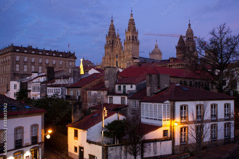 Santiago de Compostela, Spain. view of the main baroque facade of the cathedral among more buildings of Santiago de Compostela on December 6,2019