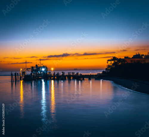 Fototapeta Naklejka Na Ścianę i Meble -  sunset aquatic sun sea landscape sunrise dusk nature cloud calm evening summer ocean port lighting florida
