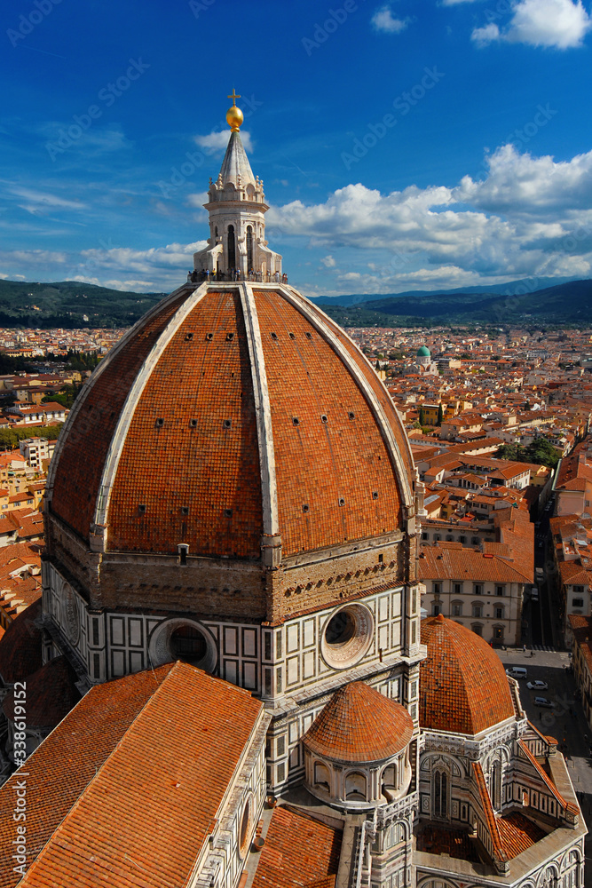 Aerial view of wonderful dome of Santa Maria del Fiore (St Mary of the Flower) in Florence with tourists at the top, built by italian architect Brunelleschi in the 15th century, a symbol of Renaissanc