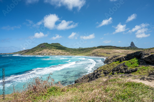 Beautiful view of Enseada da Caieira at Fernando de Noronha with the view of Pico Hill, a Unesco World Heritage site, Pernambuco, Brazil