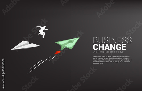 silhouette of businessman jump from white origami paper airplane to bank note money for change direction. Business Concept of changing business direction.Company vision mission.