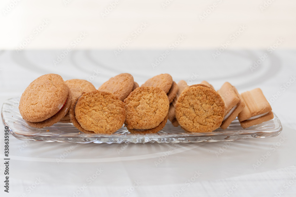 A selection of biscuits / cookies on a glass tray A selection of biscuits / cookies on a glass tray