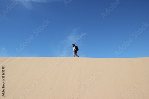 girl walking on the sand