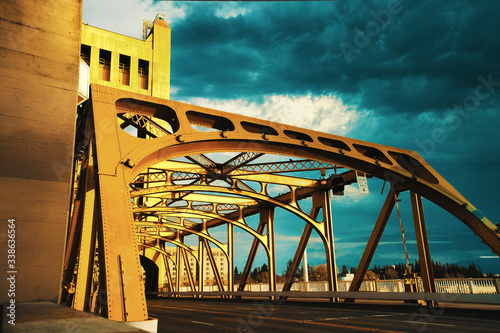 Downtown Sacramento skyline and dramatic cloudy sunset behind Tower Bridge photo