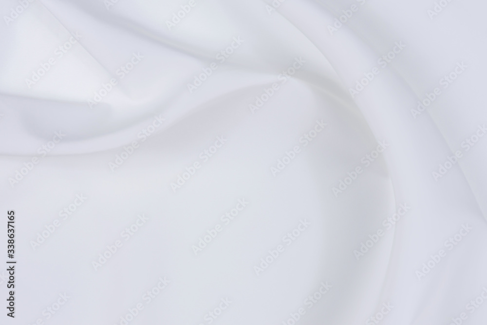Abstract white fabric texture background. Cloth soft wave. Creases of satin, silk, and cotton. Abstract white fabric texture background. Cloth soft wave. Creases of satin, silk, and cotton.