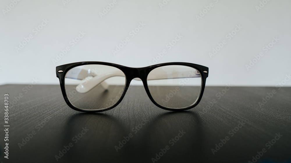 glasses on a table.  hipster glasses on a black table. glasses for vision. Computer glasses