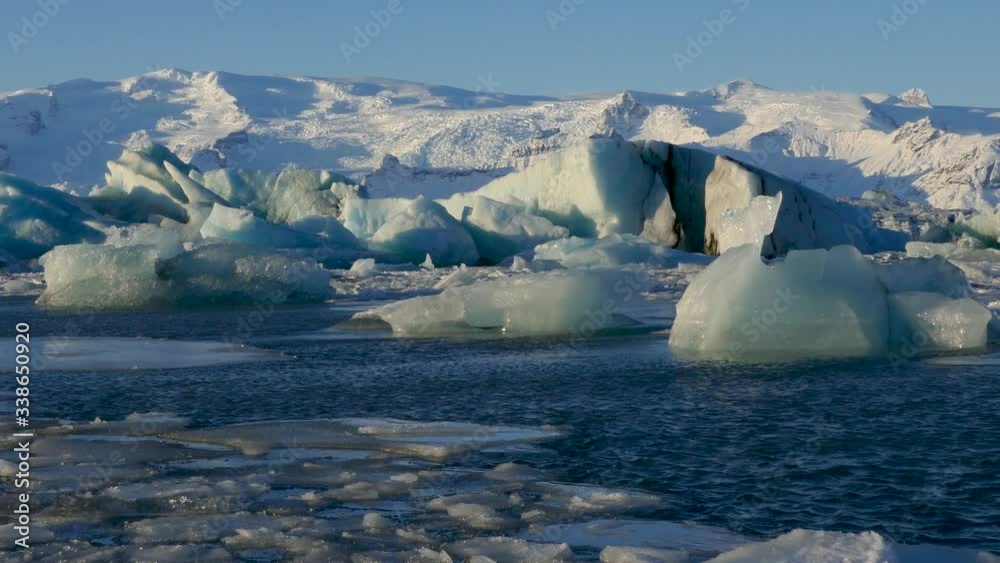 Global warming climate change iceberg floe broken from glacier melting in water Global warming climate change iceberg floe broken from glacier melting in water