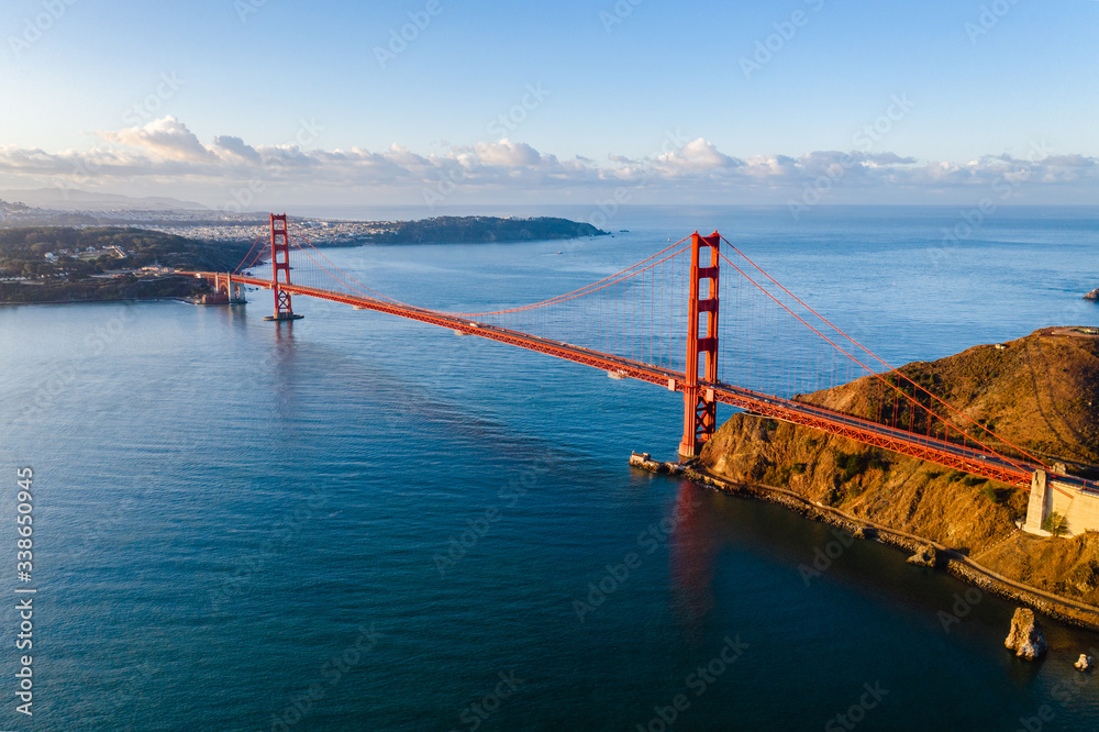 Fototapeta Busy Golden Gate Bridge with incredible scenery around it. Shot from above with a drone.