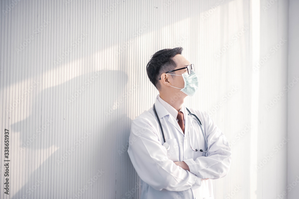 Portrait of Asian young male doctor standing Portrait of Asian young male doctor standing